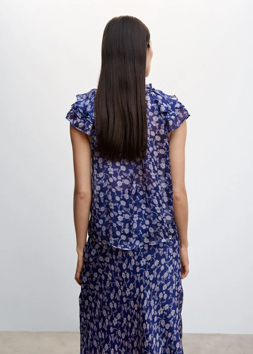 Blusa floreale volant