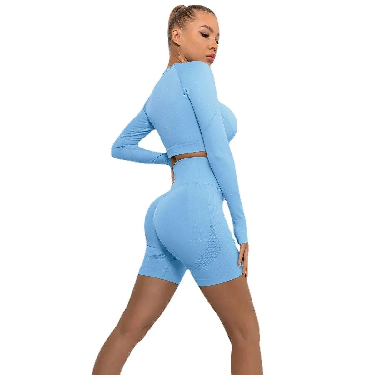 Set da yoga senza cuciture Sport Fitness Vita alta Pantaloncini per il sollevamento dell'anca color pesca Abito a maniche lunghe